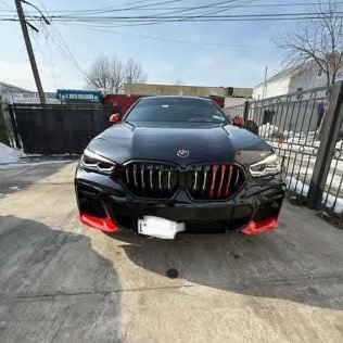 After: BMW X6 rebuilt, with custom red grille and lip