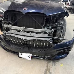 Before: BMW X6 with the front end torn off