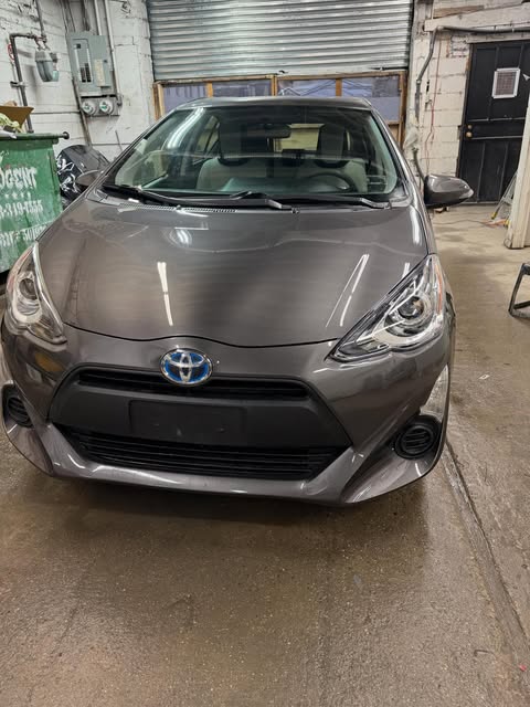 After: Toyota Prius c with new bumper and headlight