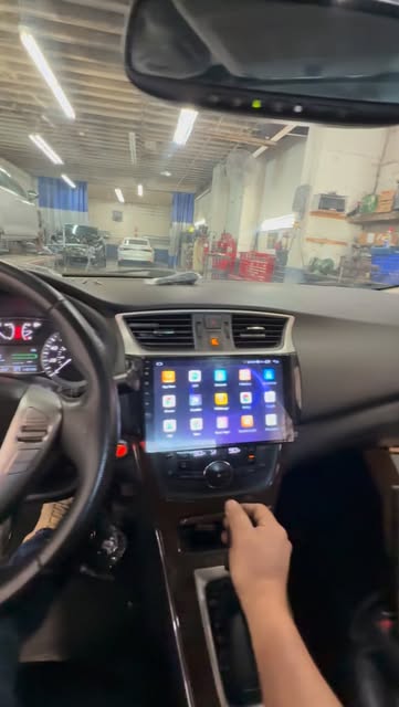 Touchscreen head unit installed in a Nissan dashboard